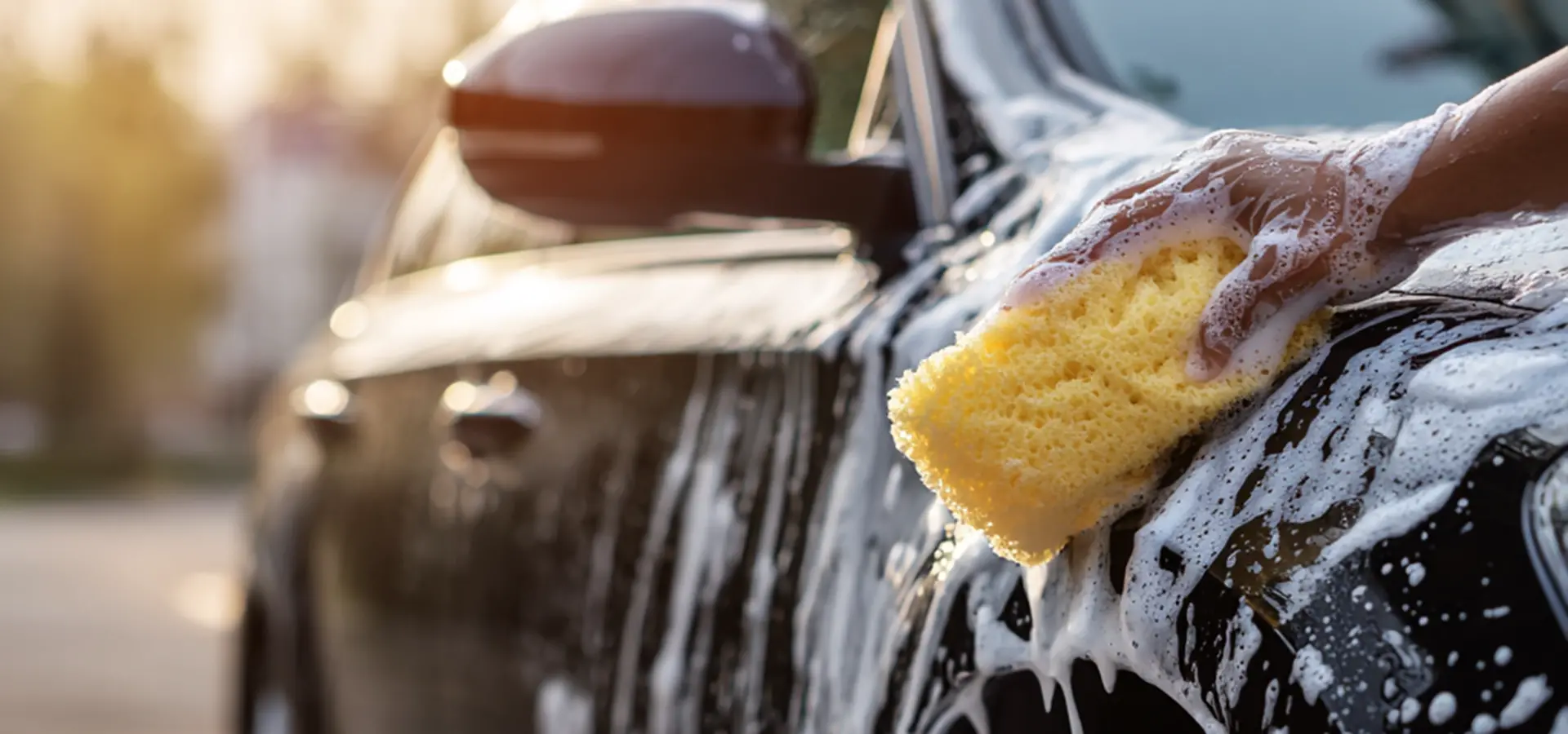 hand-washing-black-car-with-foam